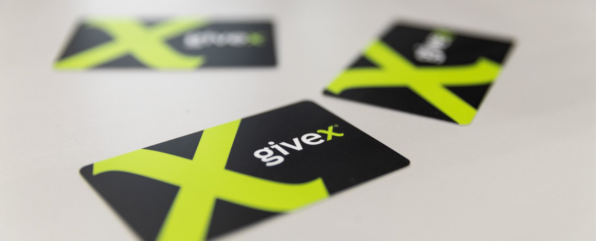 Three Givex gift cards on a table